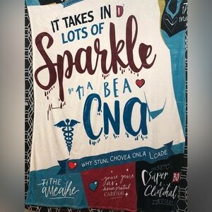 Cozy warm Blanket It Takes Lots Of Sparkle To Be a CNA graphic. 80”LX60”W